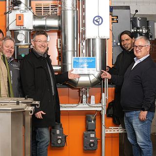Eventfotografie Saarland: Gruppenfoto bei einer Veranstaltung in der Technikzentrale von IBP