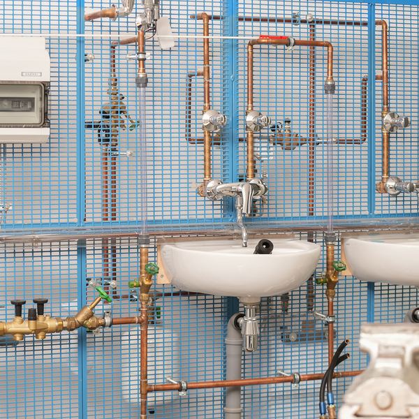 Industrial photography Saarland: sanitary training wall with pipework at IBP
